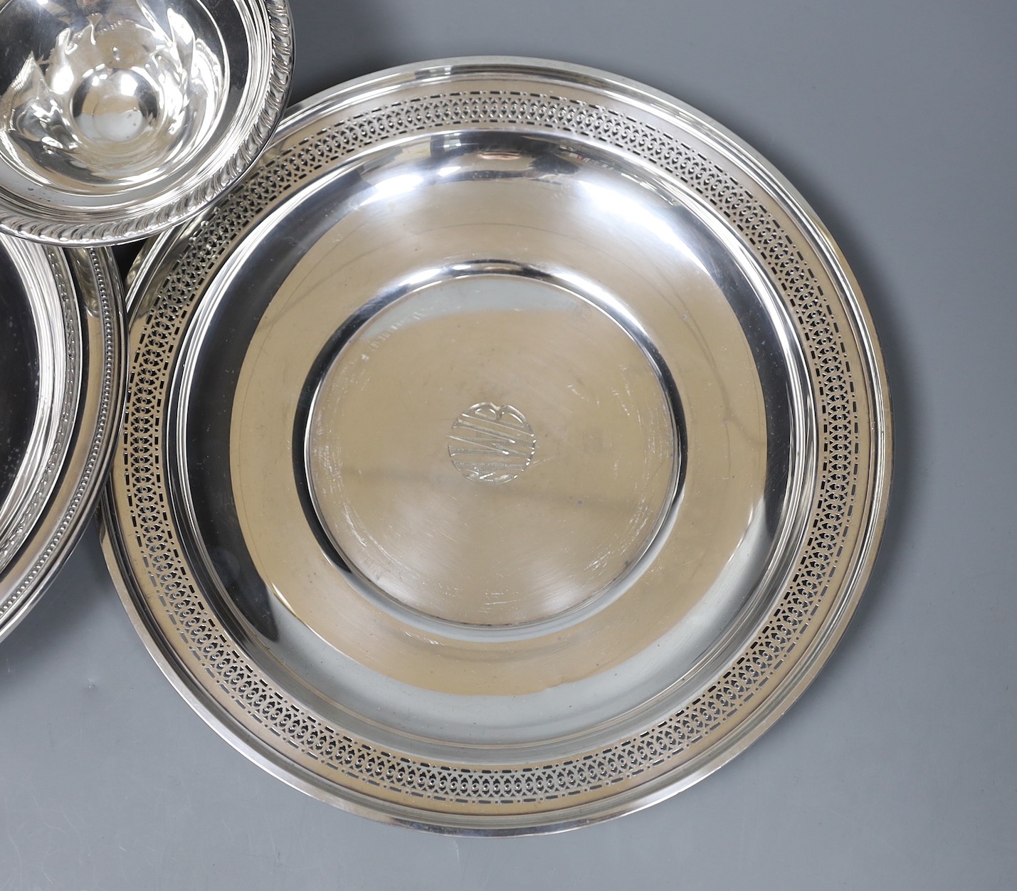 A pierced sterling shallow dish or stand, 24.5cm, a similar bowl and small pedestal dish
